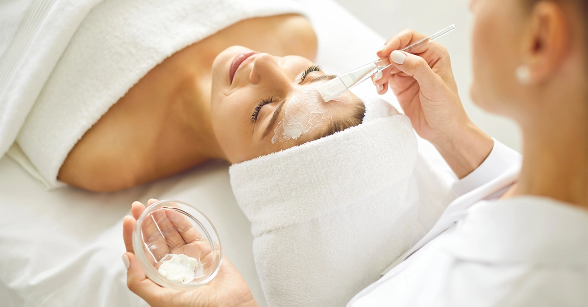 A woman getting a facial at the salon
