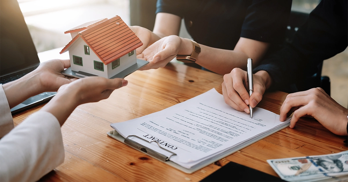 A real-estate agent completing property purchase formalities