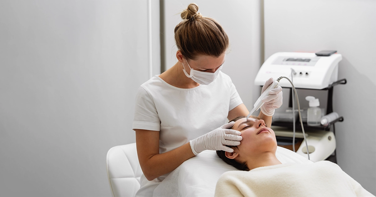 An expert aesthetician performing skin treatment
