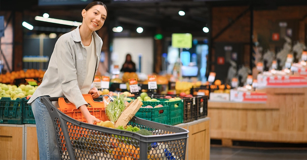 A woman buying vegetables at a market