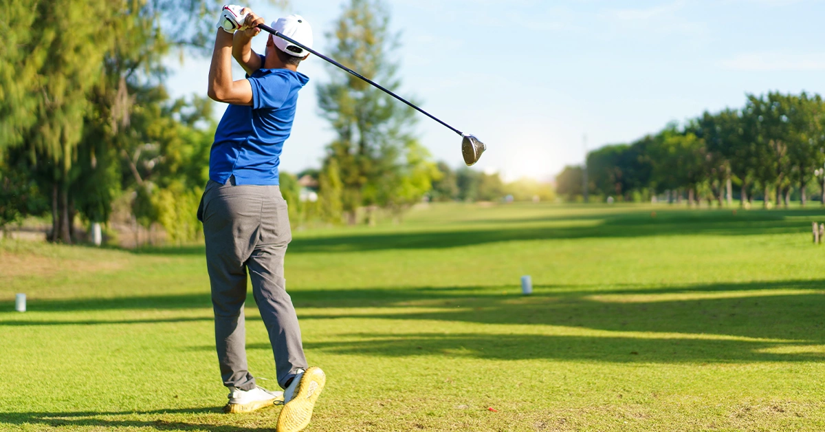 A professional golfer playing golf