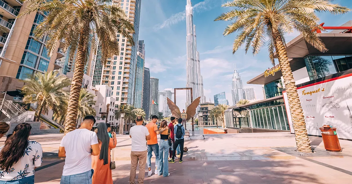 Visitors clicking pictures with the Wings of Mexico statue