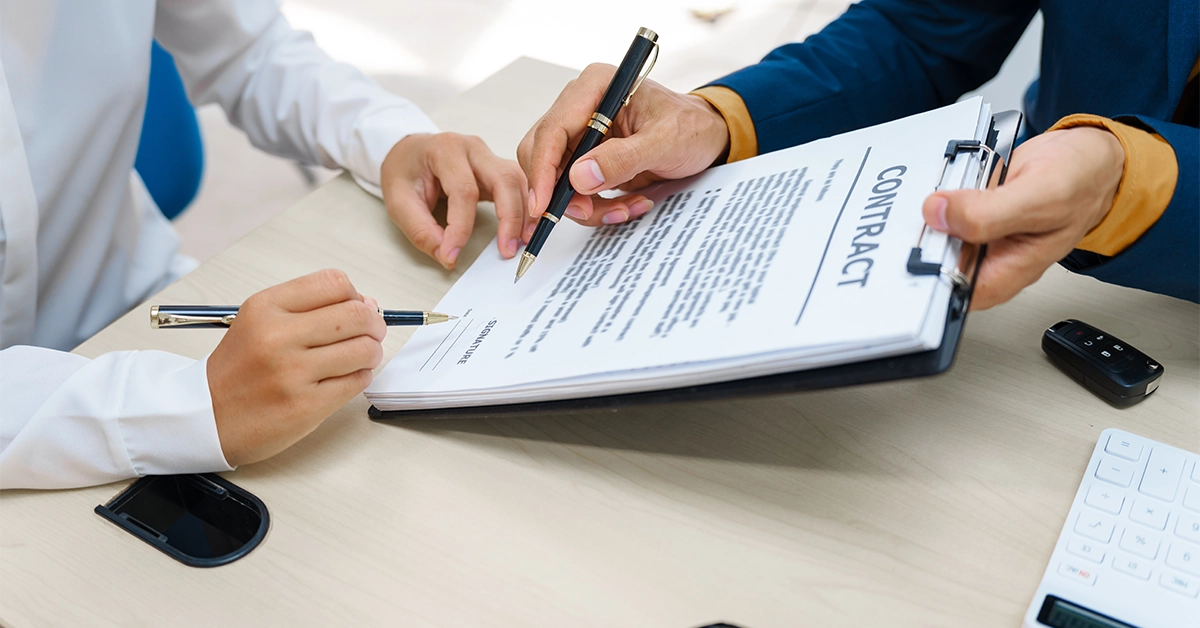 A tenant carefully reading contract conditions