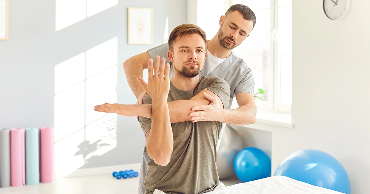 A professional chiropractor treating a patient at Falaj Al Mualla Health Centre