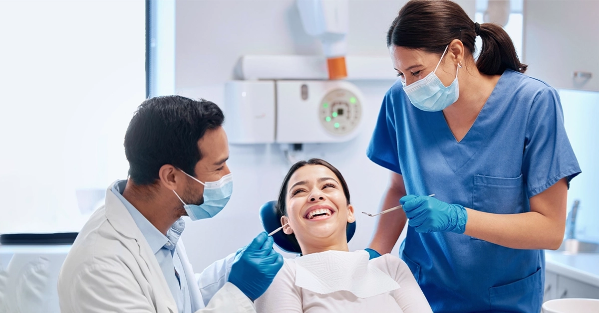 A dentist treating a patient at one of the clinics.