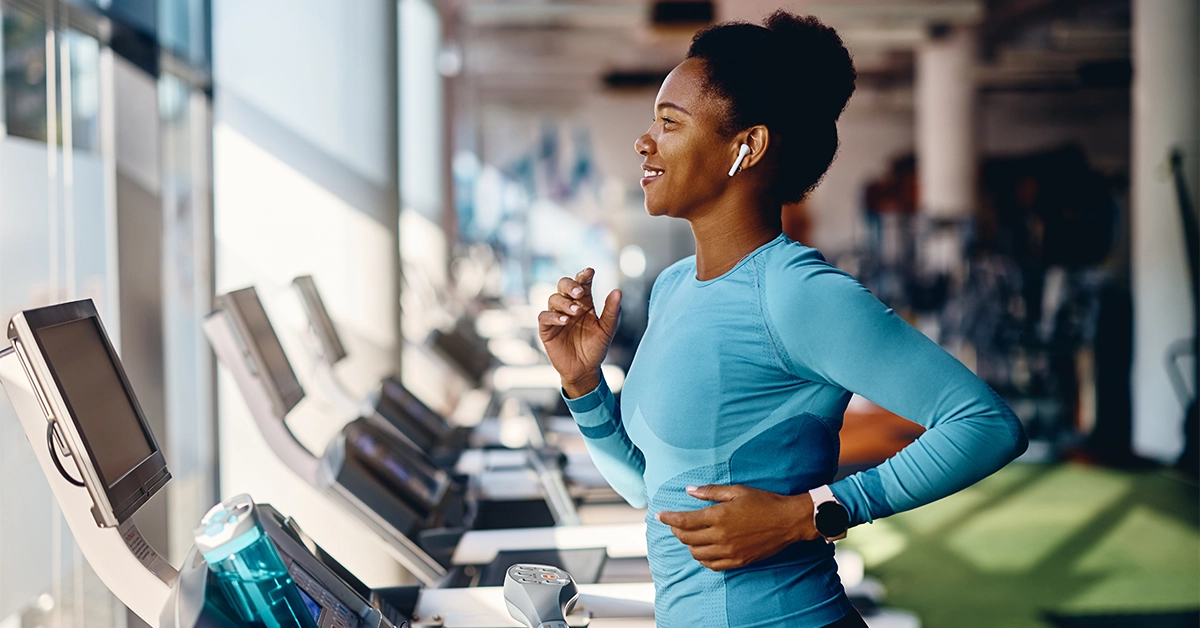 A woman jogging on a treadmill