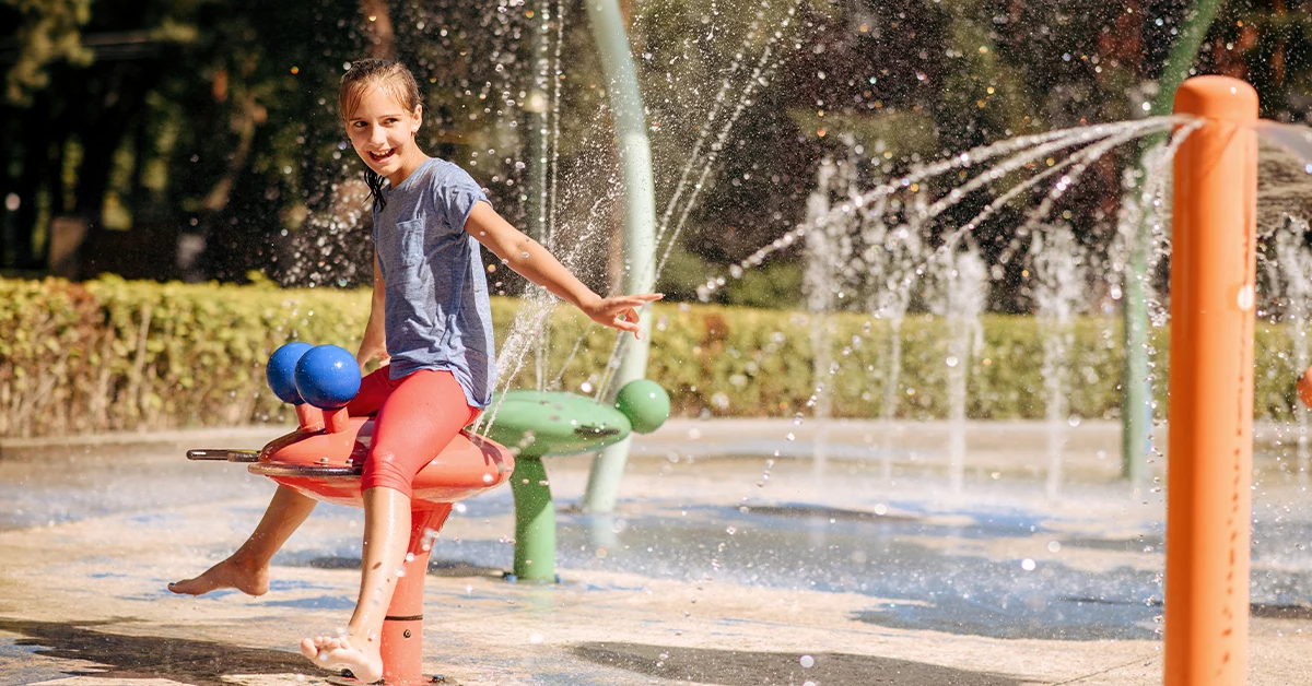 A little girl enjoying water splashes