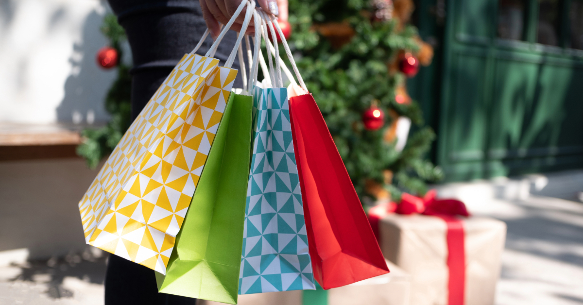 Close-up of a Woman Holding Colorful Shopping Bags