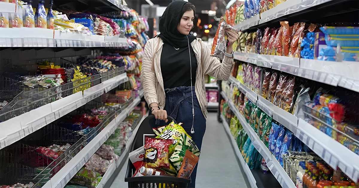 A woman buying from an Asian Supermarket in Dubai