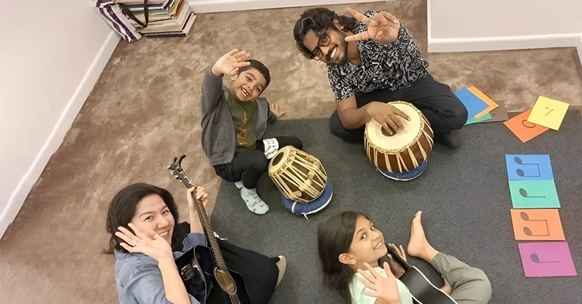 Kids learning music from their teacher