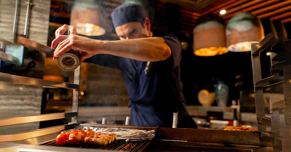 Chef preparing food in Mitsuba Japanese restaurant