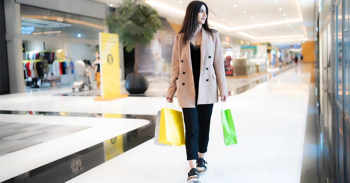 Woman after shopping from one of the Bawabat Al Sharq Mall Shops