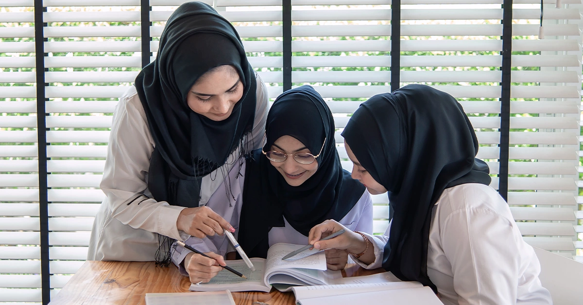 A group of students studying together in a classroom