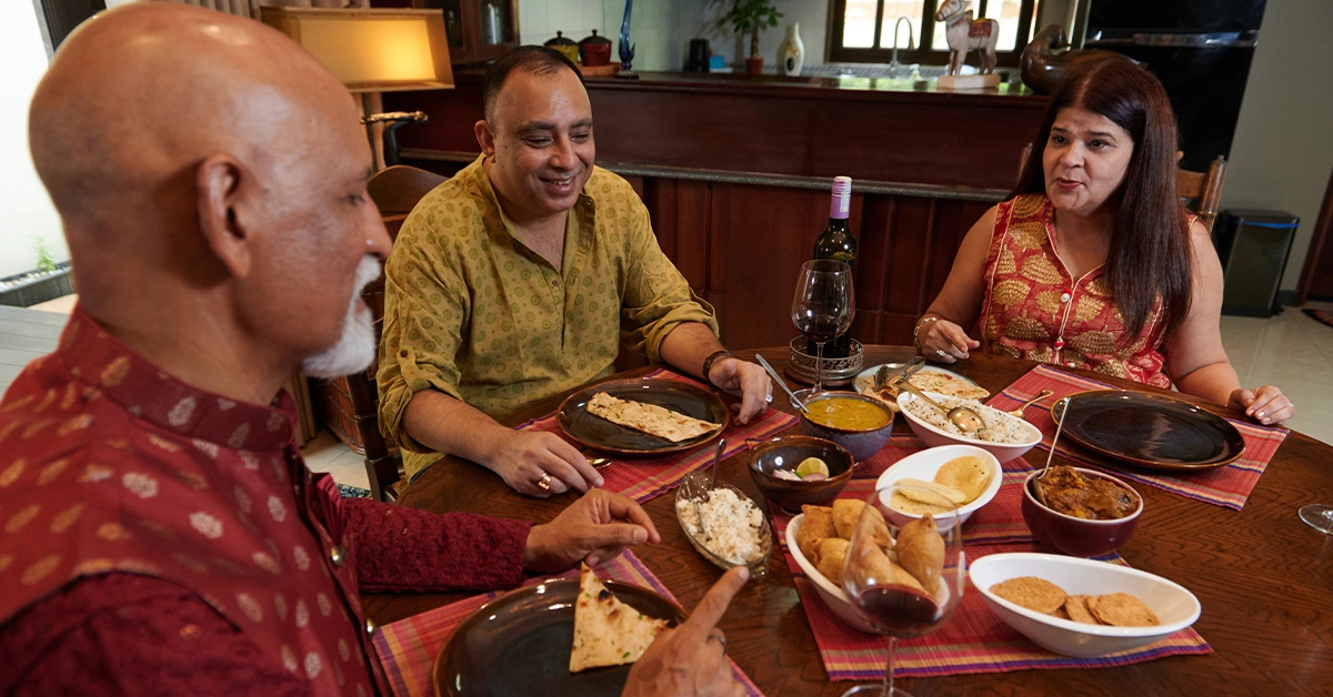 A family enjoying traditional food at an Indian restaurant in Jumeirah