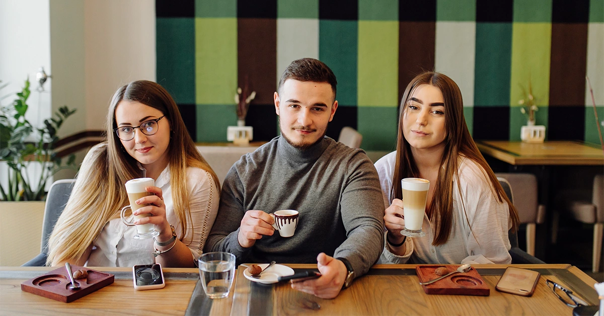 A group of people at OLAB Cafe in Motor City