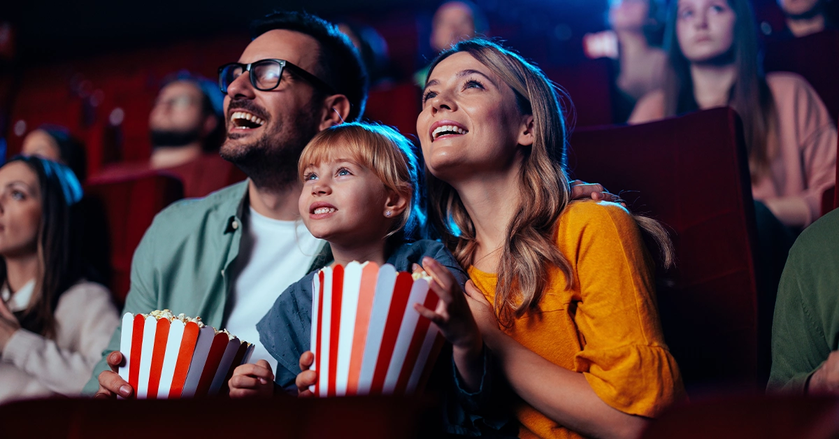 A family enjoying a movie at VOX Cinema in City Centre Ajman
