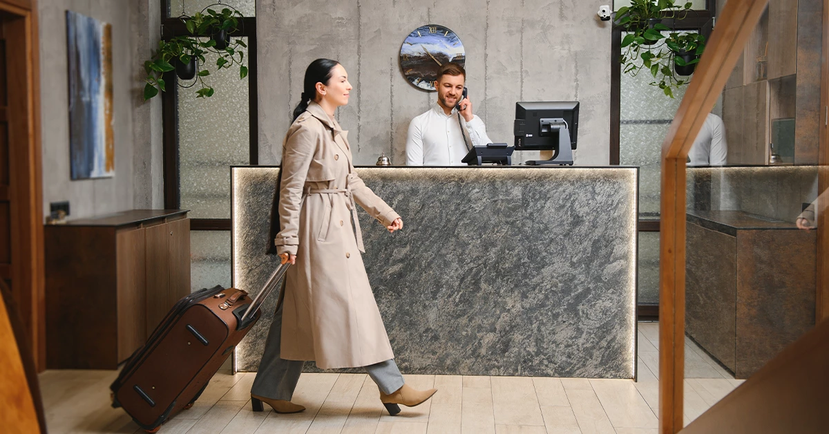 Woman Checking in Hotel