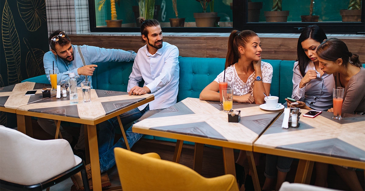 Groups of friends ordering food at a restaurant