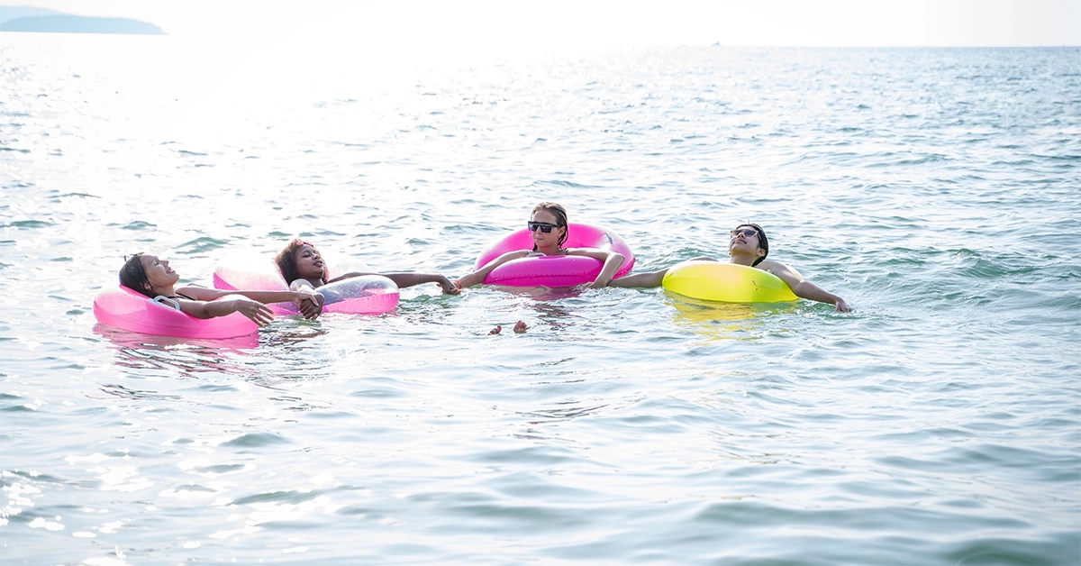 People swimming at Halat At Bahrani