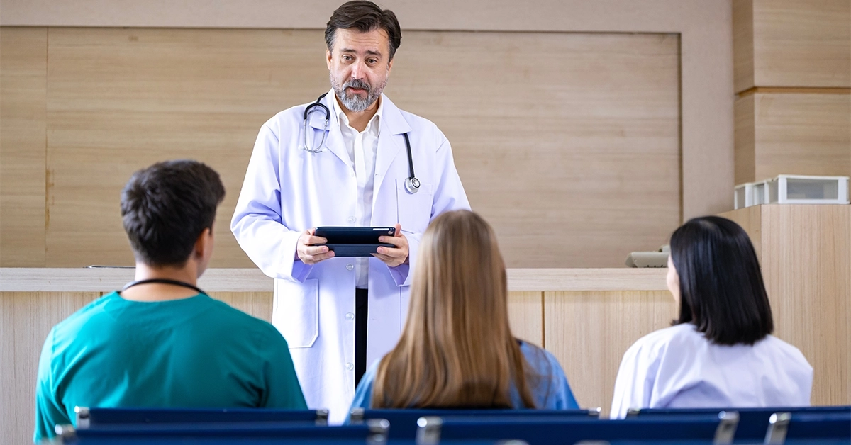A senior doctor discussing a case with young students in one of the top medical universities in the UAE