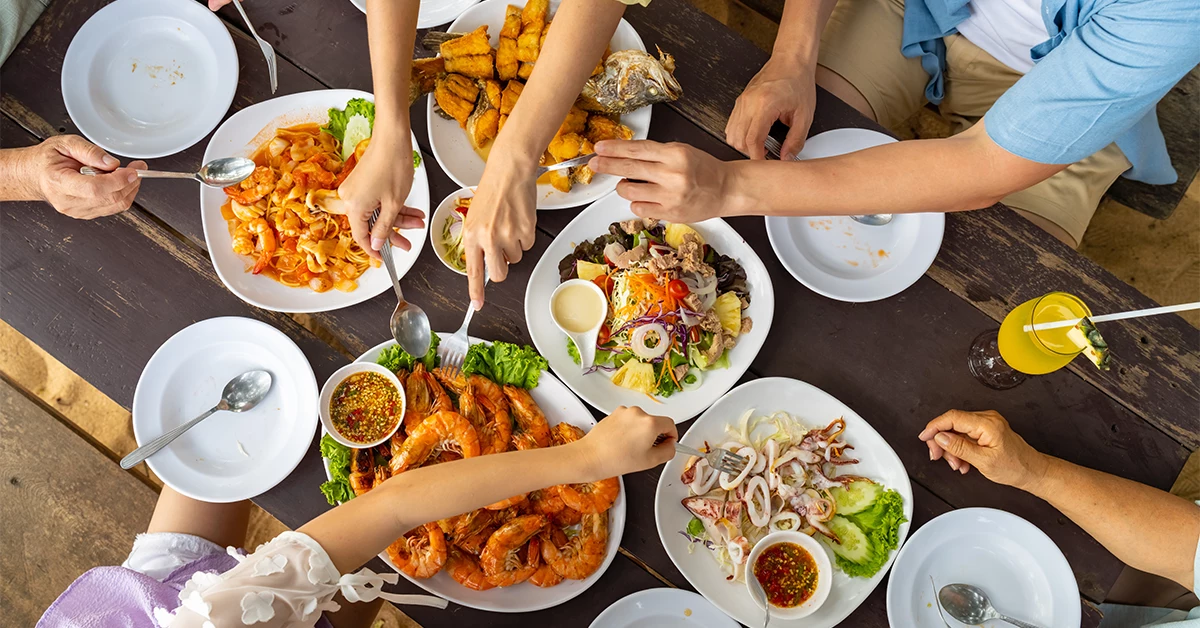 People enjoying seafood