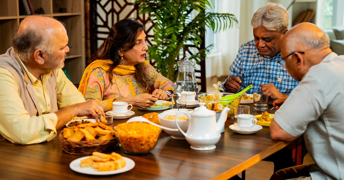 A family having conversations over food at one of the good Indian restaurants in Business Bay 