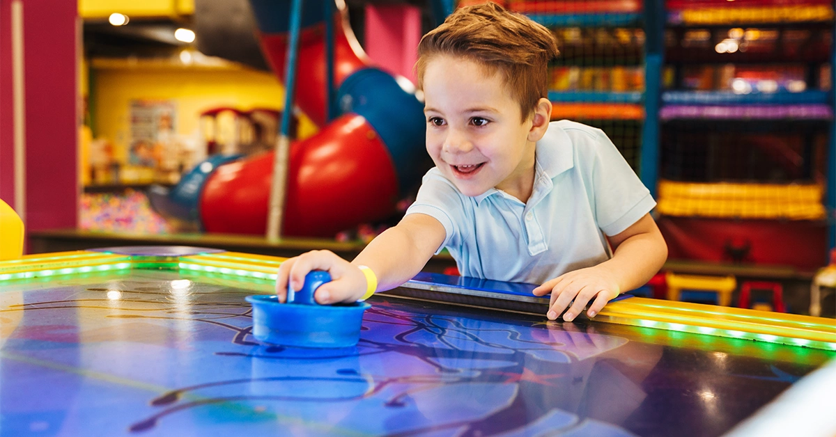 A little boy playing at a popular cafe with a play area in Dubai