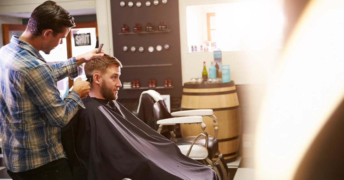 Man having a haircut at Khoodi Style salon, barsha heights