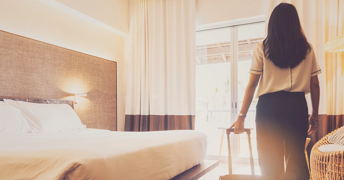 A woman entering a hotel room