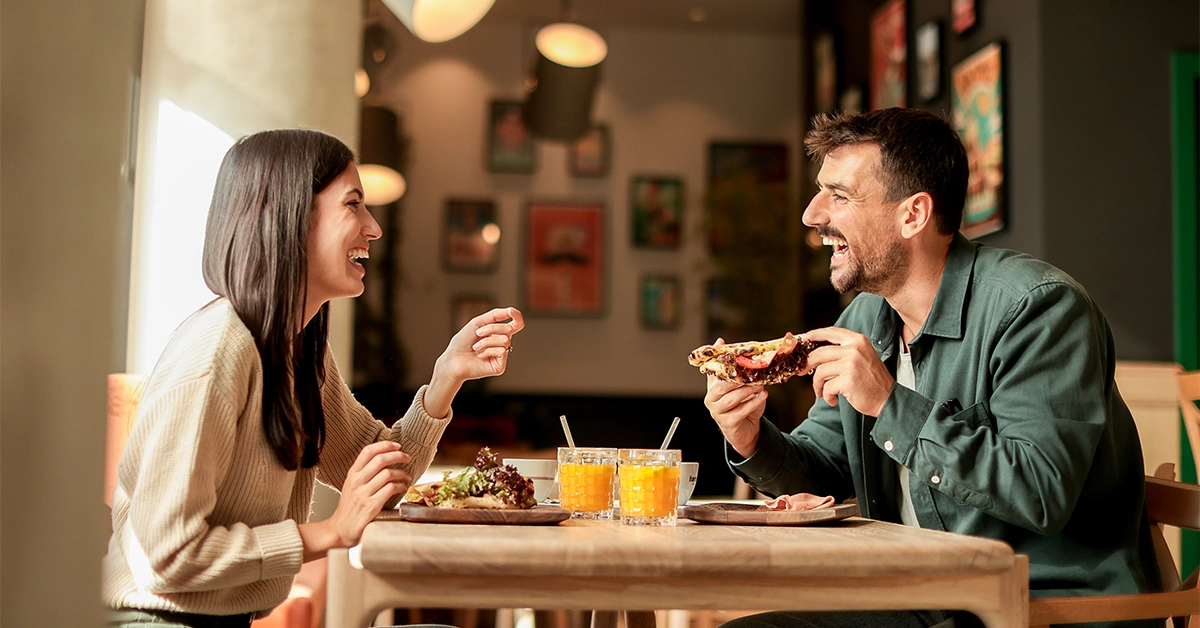 A couple enjoying Indian food 