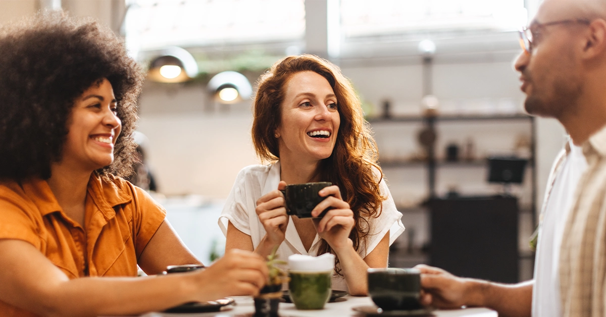Friends catching over coffee at a cafe
