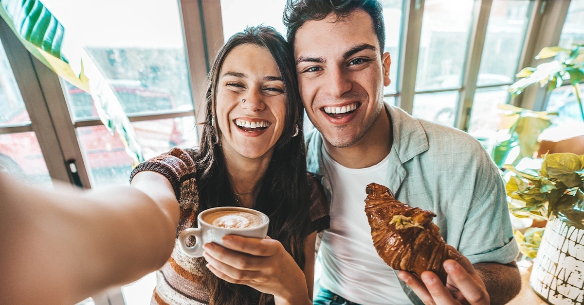 A young couple having breakfast at a cafe