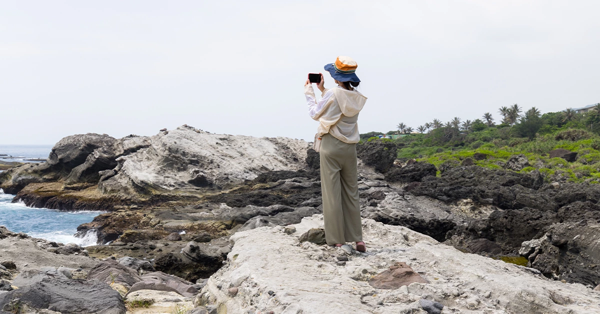 A girl taking photos at Jazirat Badiyah