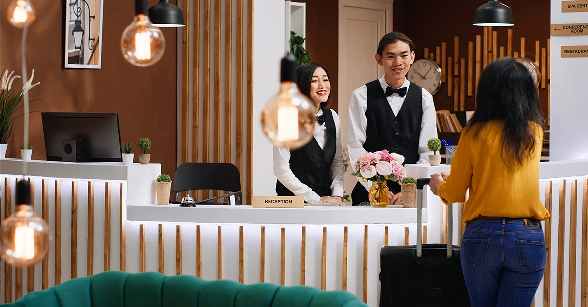 Front Desk employees greeting customer