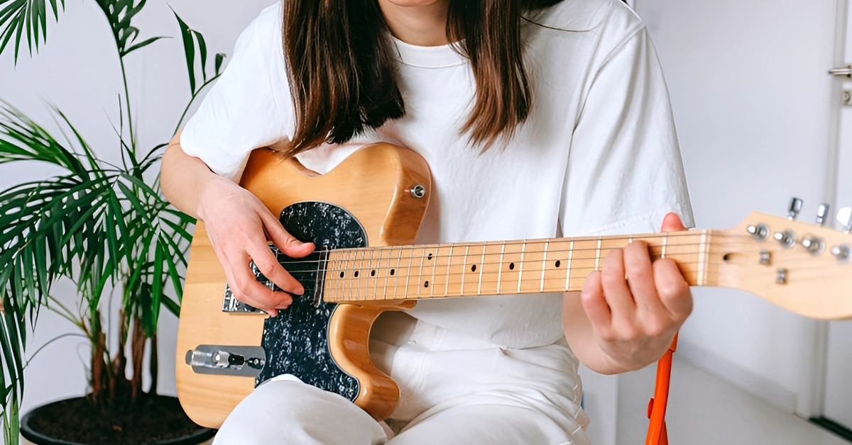 Lady playing guitar