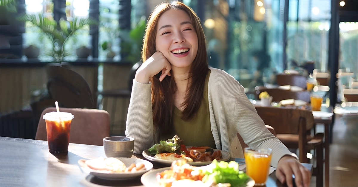 A girl having food at one of the top Indian restaurants in Palm Jumeirah