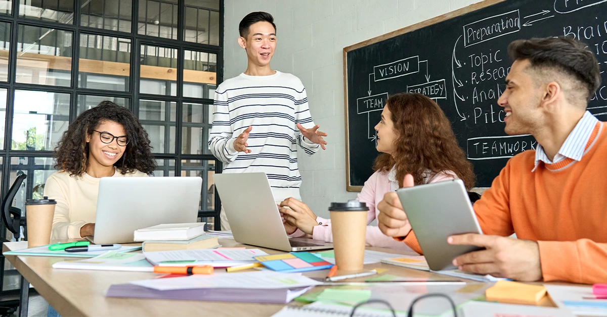 Multicultural students studying together at one of the best business schools in Dubai