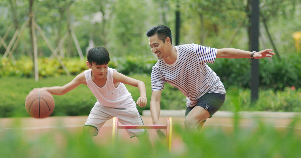 Son and Father playing Basketball