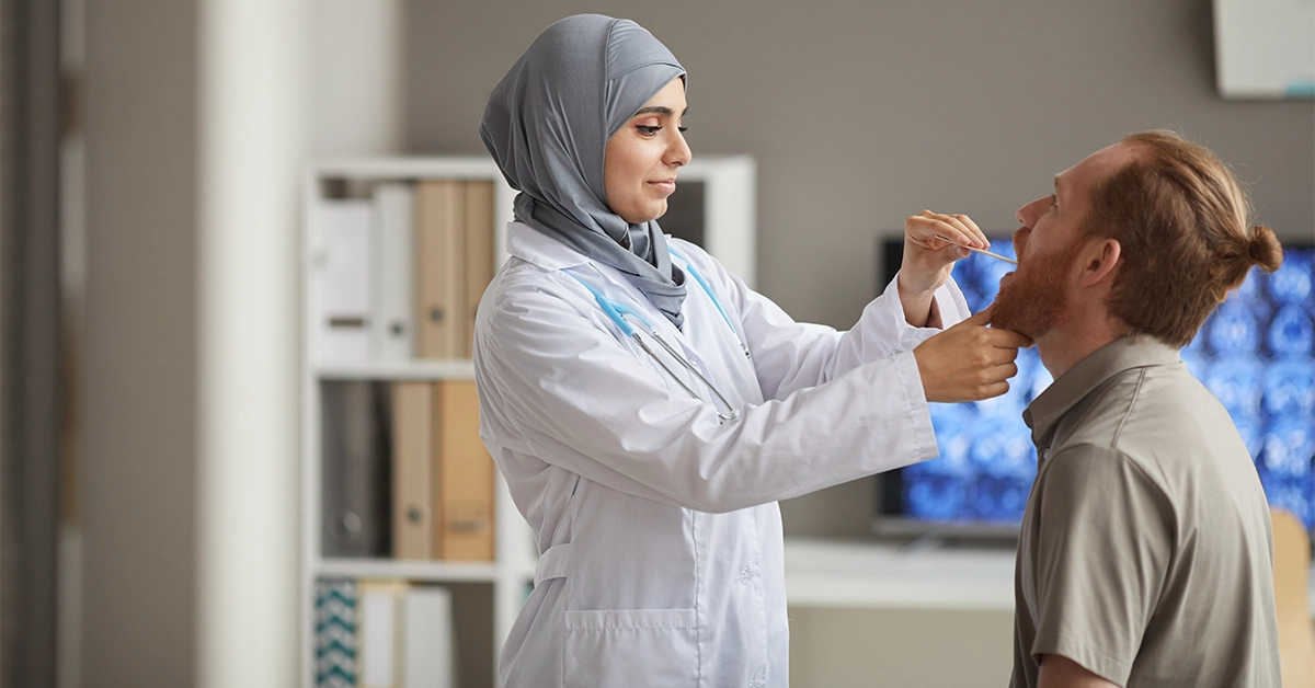 A female doctor examining a patient at a hospital near Al Noaf