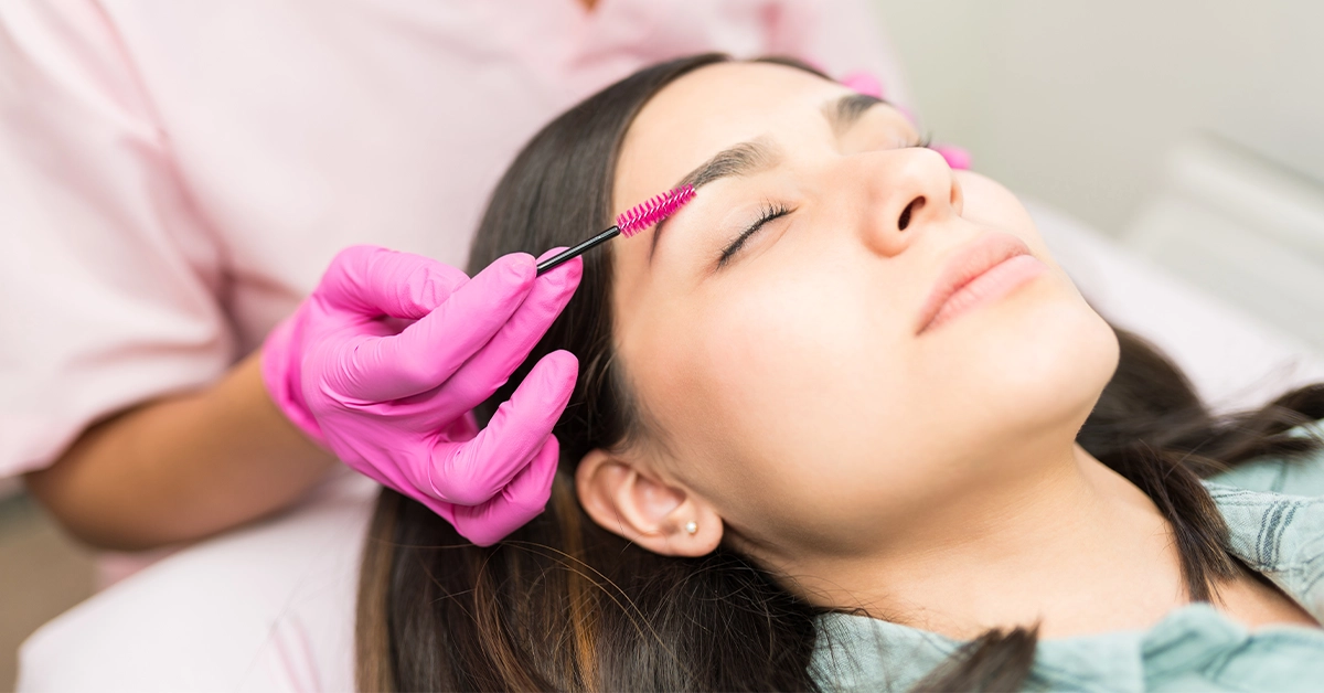 Woman getting her eyebrows done