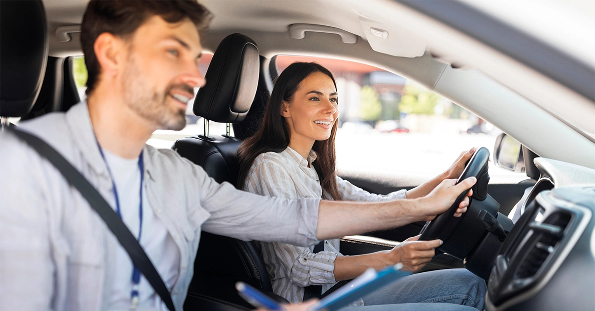 Man Teaching a Woman How to Drive