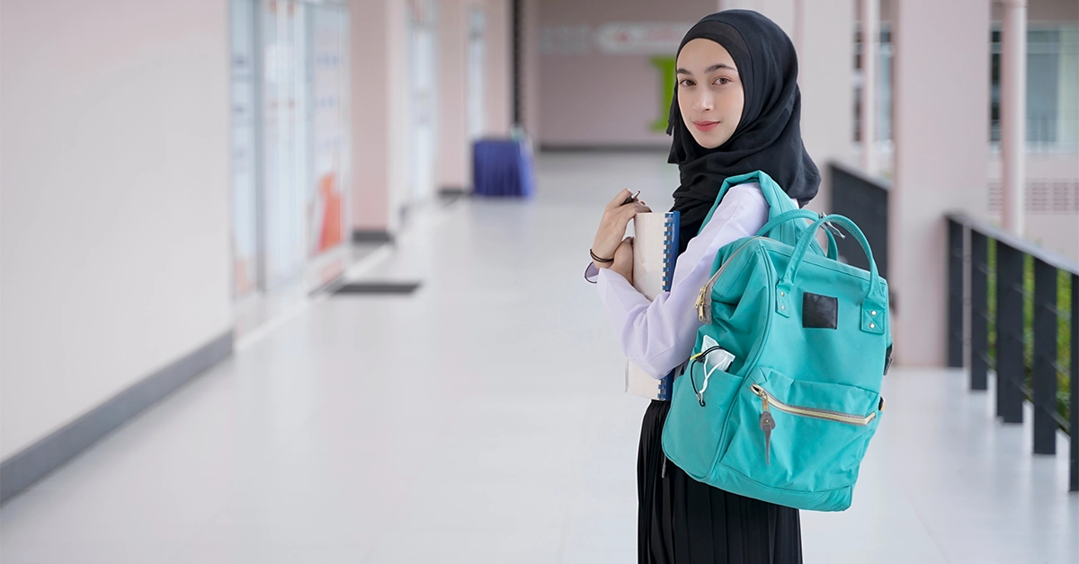 A student holding a book