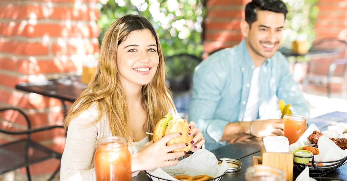 A couple enjoying lunch at Sloane Street Kitchen in Jumeirah Golf Estates