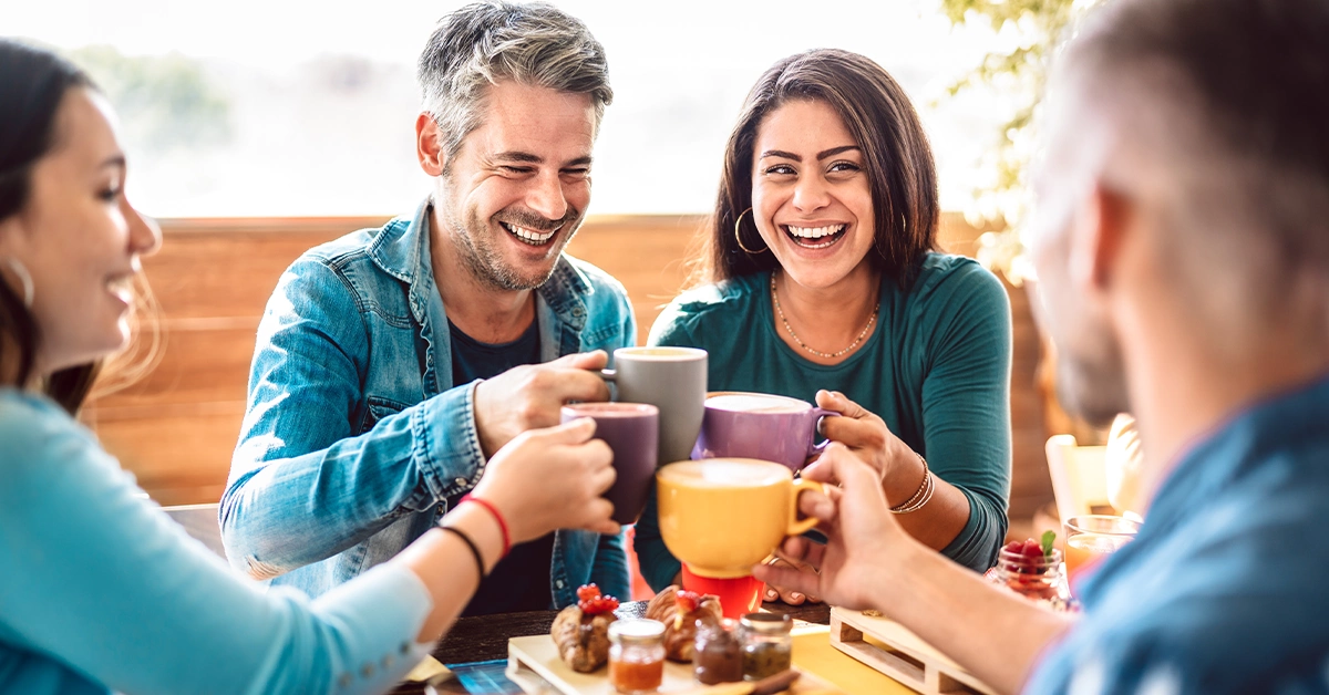Friends enjoying coffee with good food