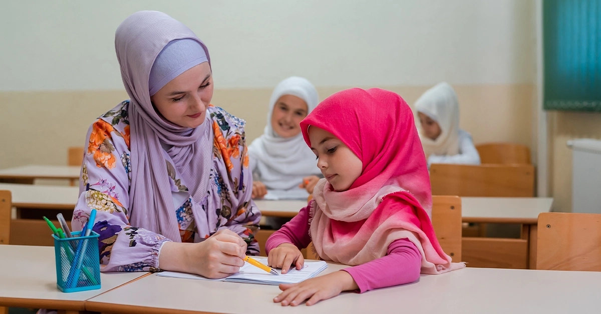 A female instructor helping a student learn language basics