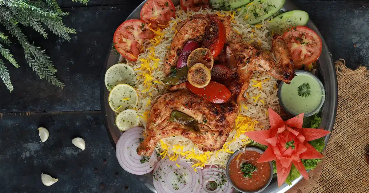 Grilled chicken served with rice at Qasr Al Afghan Mandi restaurant Ras Al Khaimah