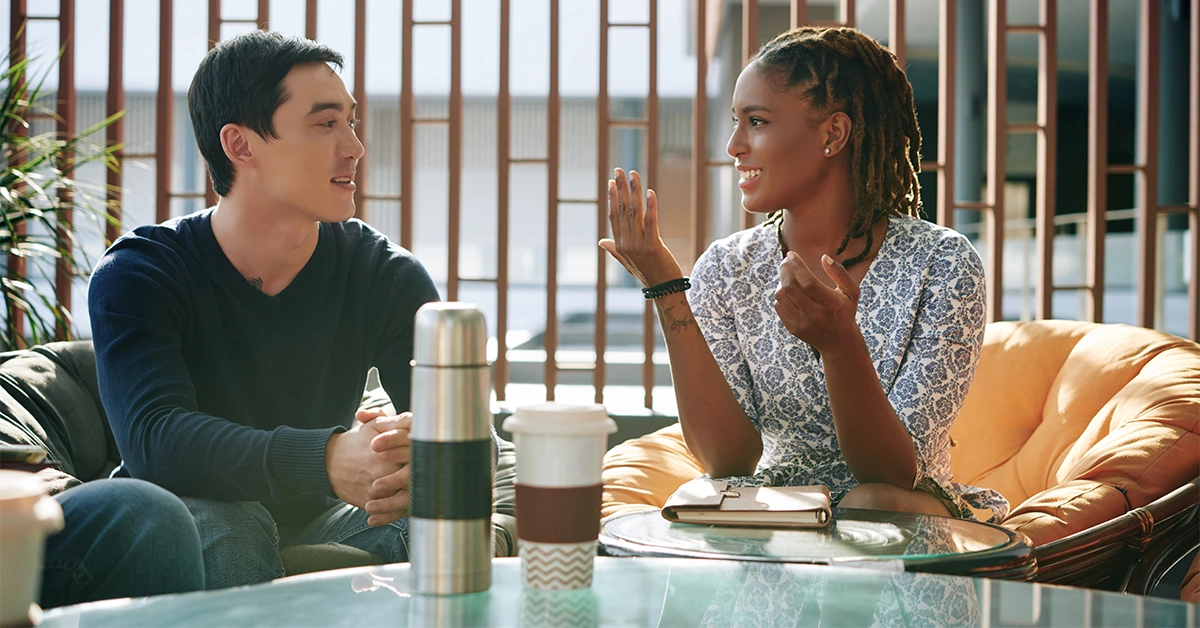 Four friends having coffee together