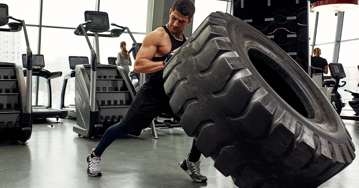 A man doing strength building workout at Sahara Fitness Centre in Abu Shagara