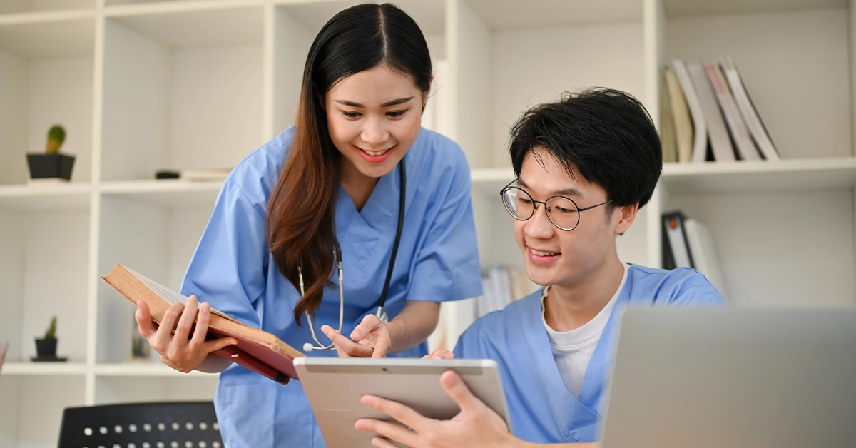 Two students discussing a group project