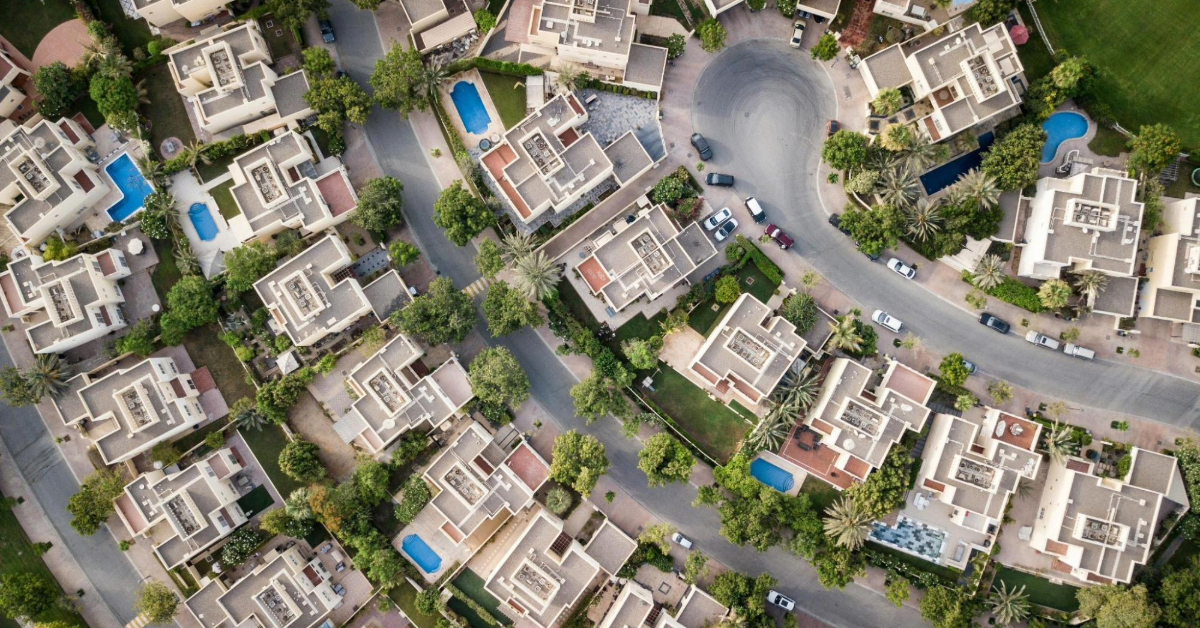 Aerial view of residential community in Dubai showing villas and real estate investment options